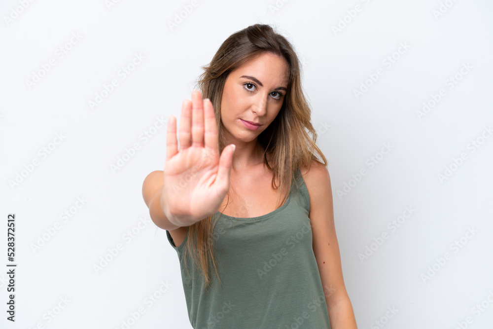 Young caucasian woman isolated on white background making stop gesture Young caucasian woman isolated on white background making stop gesture