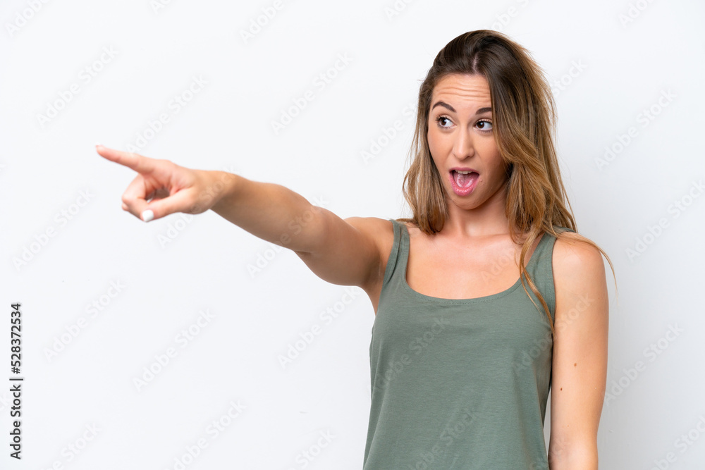 Young caucasian woman isolated on white background pointing away Young caucasian woman isolated on white background pointing away