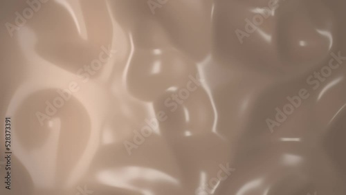 Nude foundation liquid material waves background. Skin color abstract smooth shiny texture for cosmetics commercial. Macro surface shot. Top down shot