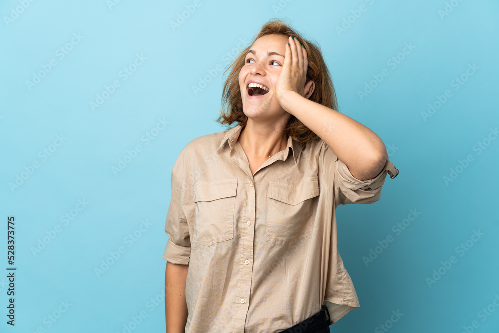 Young Georgian woman isolated on blue background has realized something and intending the solution Young Georgian woman isolated on blue background has realized something and intending the solution