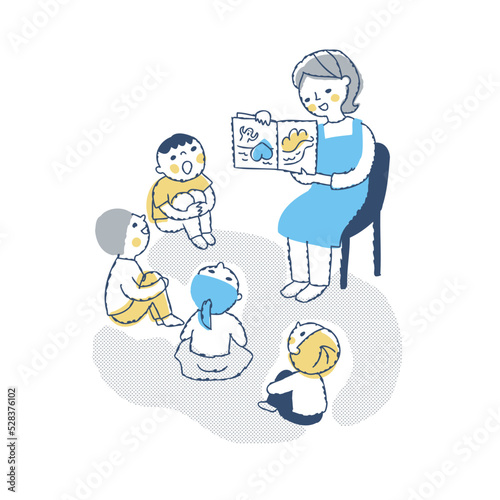 絵本の読み聞かせをする保育士と子供たち