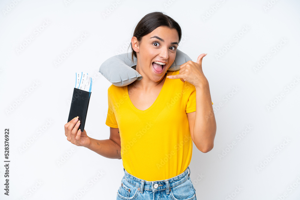 Woman with Inflatable Travel Pillow over isolated background making phone gesture. Call me back sign Woman with Inflatable Travel Pillow over isolated background making phone gesture. Call me back sign