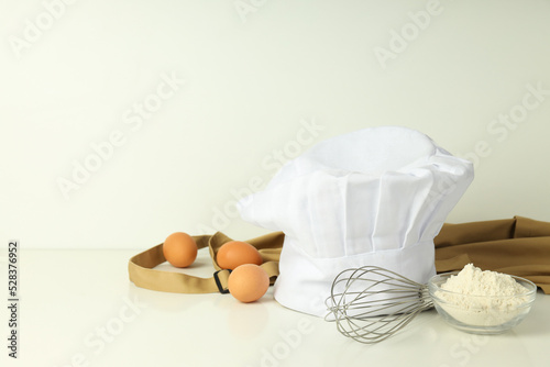 Composition with chef hat for concept of cooking, space for text