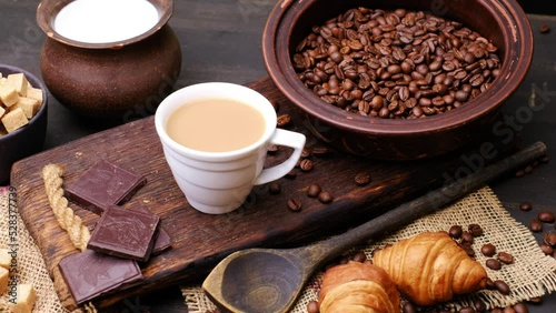Coffee, croissant, chocolate and white sugar. Close-up 4k video shooting