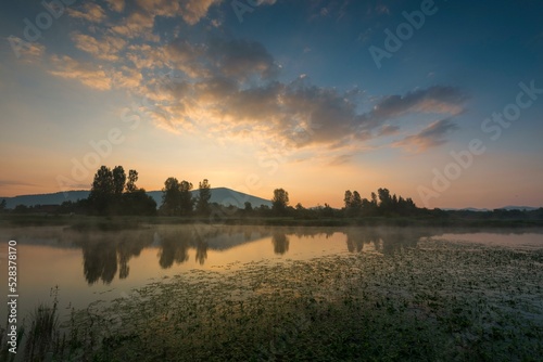 Fototapeta Naklejka Na Ścianę i Meble -  Sunrise at the lake Cerknica, Cerknisko jezero, intermittent lake, Cerknica Polje, Nature reserve Rakov Skocjan, Slovenia, Europe