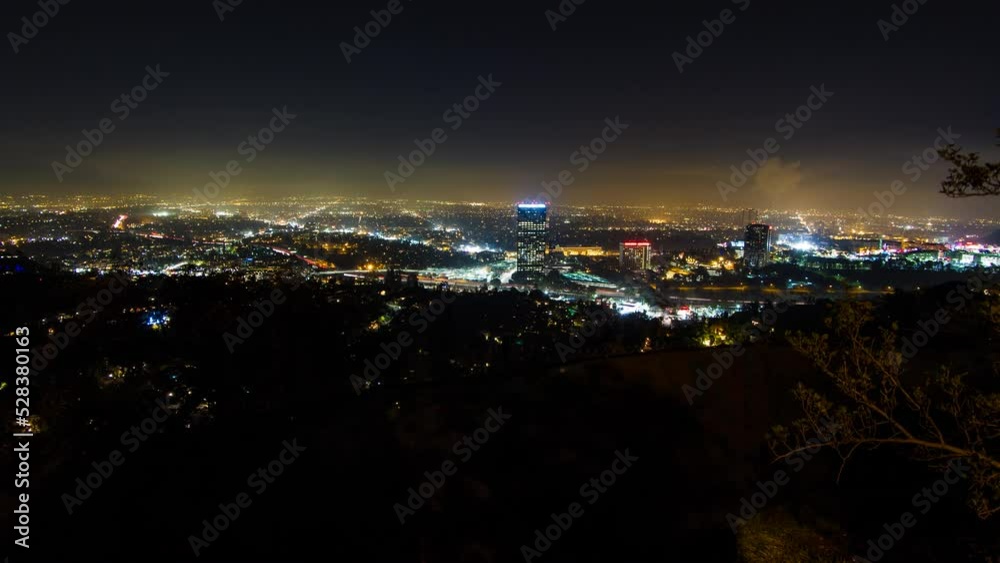 Aerial Lockdown Time Lapse Shot Of Illuminated Residential City Seen From Mountain At Night - Los Angeles, California Aerial Lockdown Time Lapse Shot Of Illuminated Residential City Seen From Mountain At Night - Los Angeles, California