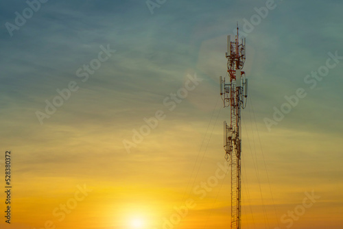 Telecommunication tower with sun rise background,cellular mobile pole communication technology.