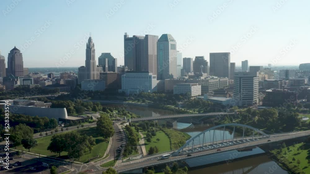 Columbus, Ohio skyline with bridges and river with drone video moving forward. Columbus, Ohio skyline with bridges and river with drone video moving forward.