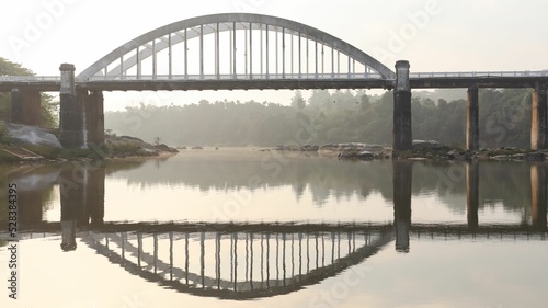 The Beautiful Reflection of Bridge in Tunga River of Tirthahalli photo