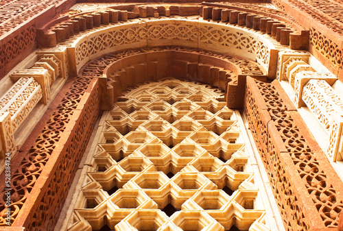 Wall art sculpture in Qutub Minar. Sculpture mural on Sandstone in qutub minar, Delhi, India. 