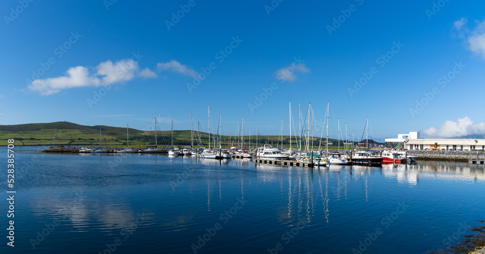 view of many sailboats in the marina and harbor in Dingle village in County Kerry