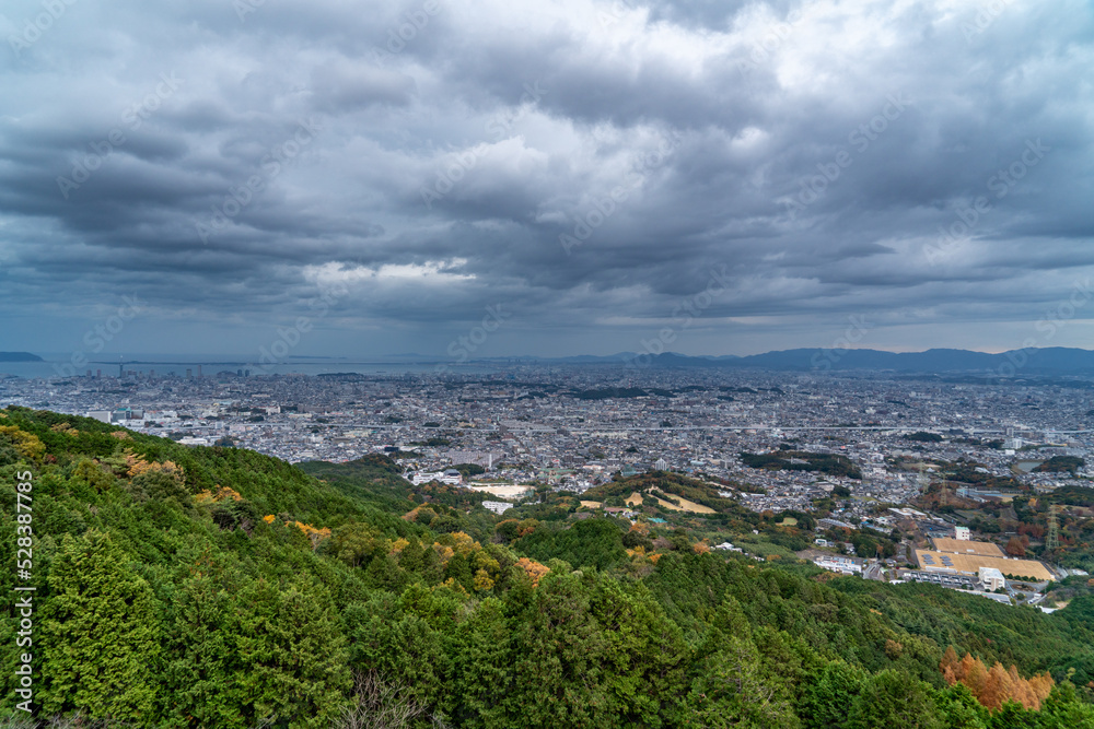 View of Fukuoka city and sea from hill in autumn.