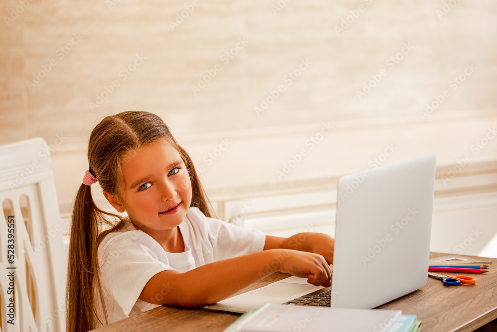 happy child uses laptop to study online class happy child uses laptop to study online class