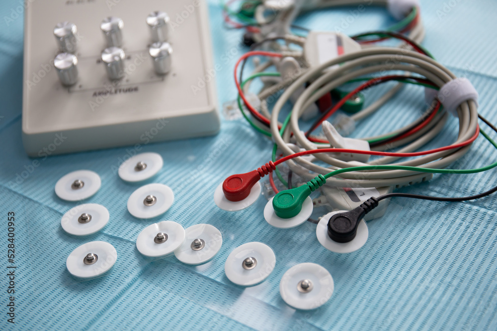 Device for neuromuscular stimulation of temporomandibular joint with wires and electrodes on the