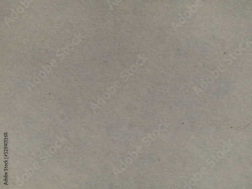 The background texture of paper, macro photo. Texture of yellowed paper for use as a background