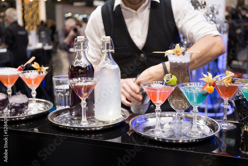 Bartender making cocktail at bar counter. Selective focus.