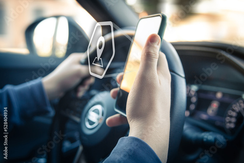 Drive using smartphone. Automotive technology concept. Infotainment, navigation communication device © Fabio Principe
