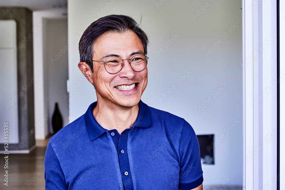 Happy mature man wearing eyeglasses at home Happy mature man wearing eyeglasses at home