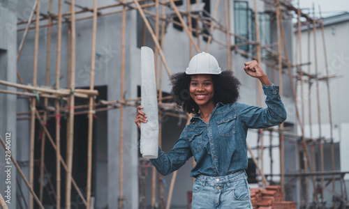African American architects inspecting security at job sites.Professional Manufacturer Manager Woman Wearing Helmet.Building construction architect.