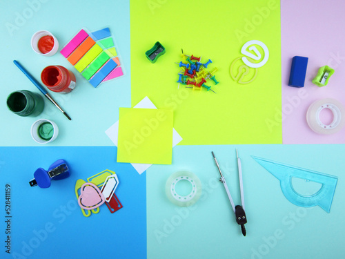     school supplies on abstract colorful background texture 