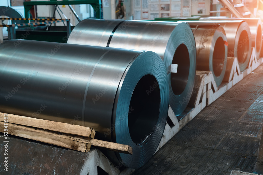 Rolls of steel sheets. Metal coils in metalwork factory workshop. Rolls of steel sheets. Metal coils in metalwork factory workshop.