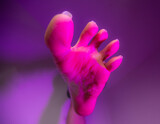 Person sole foot fetish stepping on camera surrounded with artistic colorful pink color