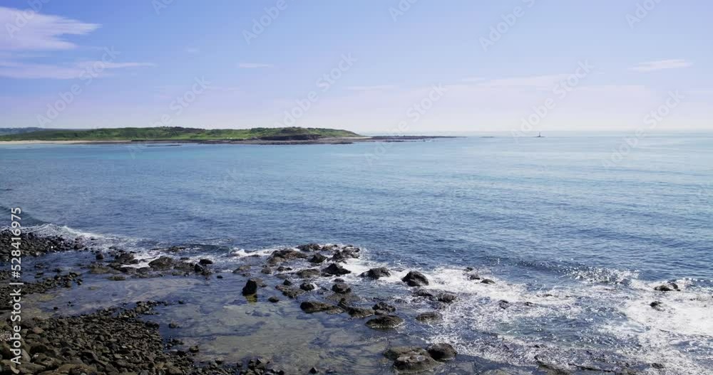 Stone rock sea beach with sunny sky Stone rock sea beach with sunny sky