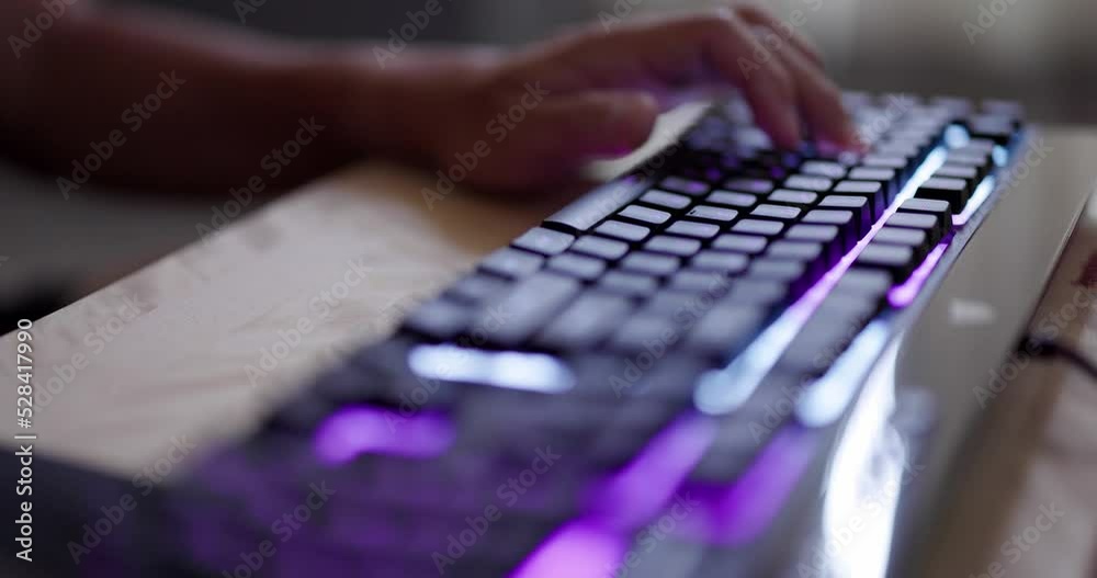 Cyber sport gamer play game with RGB keyboard Cyber sport gamer play game with RGB keyboard