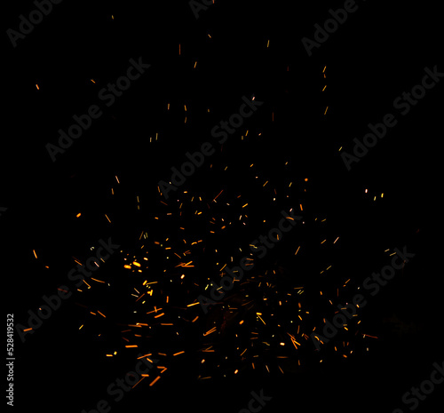 Campfire flame sparks isolated on black background. Fire flames heat energy heap in the night. Fire sparkles isolated on black