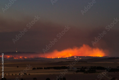 bushfire burning in rural area at dusk