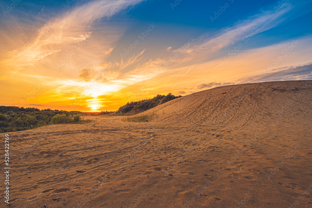 Colorful sunset over an abandoned sand pit