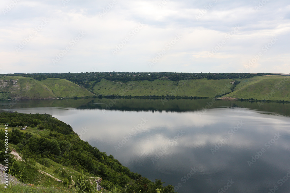 Bakota Bay view. The panoramic landscape of Dniester river, Ukraine. The banks of a large river with calm smooth water.