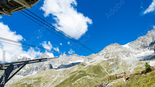 The arrival station of the famous Skyway, the cable car connecting Courmayeur to the higest peaks of Monte Bianco (White Mountain), Courmayeur, Italy. Blue sky on the background. photo