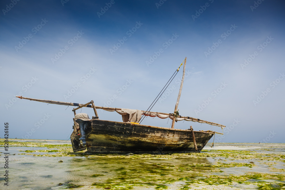 Authentic african boat in beautiful turquoise ocean beach, Zanzibar island