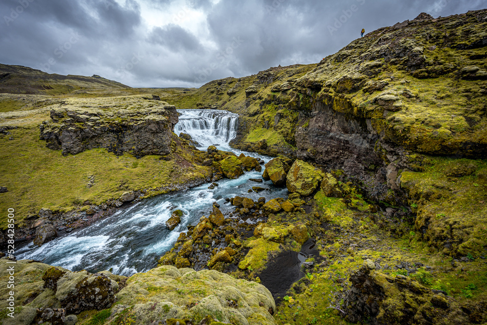 Waterfall in mountains, Iceland