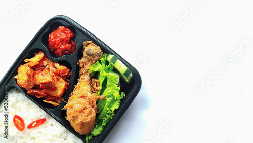 nasi kotak ayam goreng. rice box fried chicken