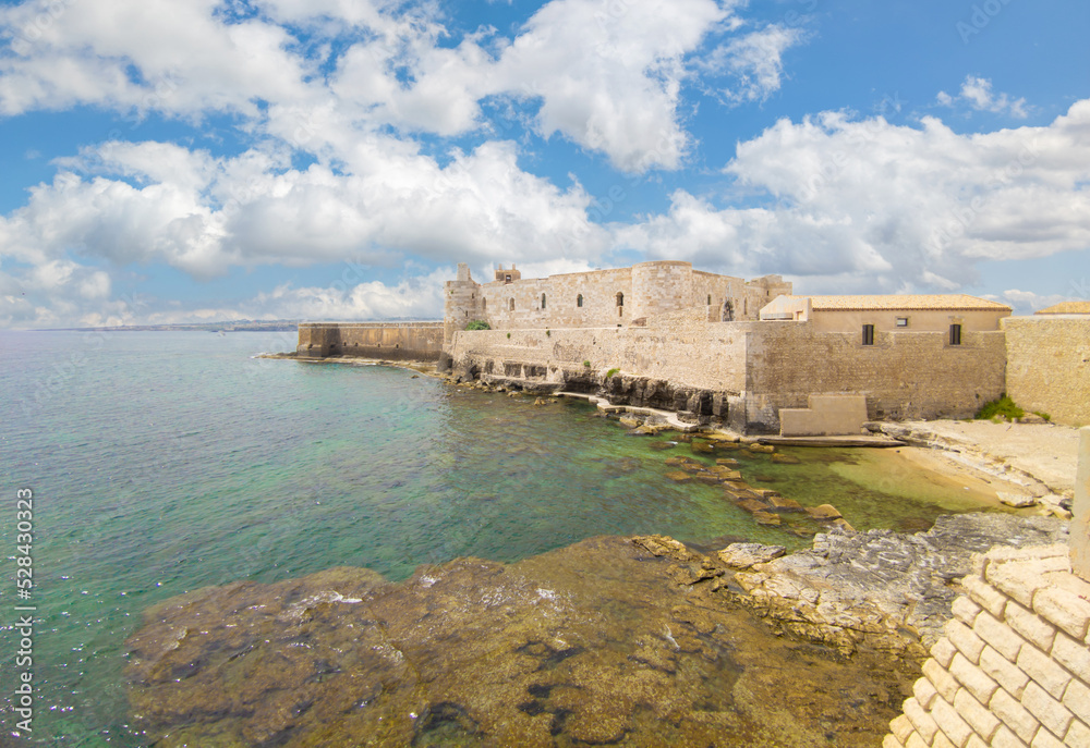 Ortigia island of Siracusa (Sicilia, Italy) - A historical center view of the touristic baroque island in the municipal of Siracusa, Sicily, during the summer; UNESCO site, with castle and old church
