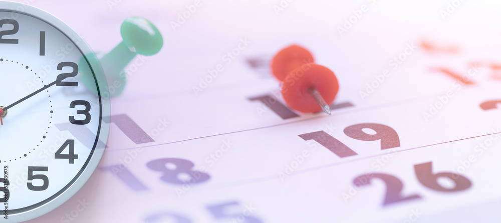 Time management concept. clock and calendar with marked dates. Stock