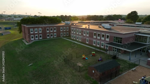 Aerial of American school building at summer sunset. Education theme in USA. photo