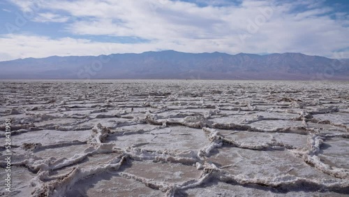 Otherworldly landscape of Badwater Basin salt flats, Death Valley, California photo