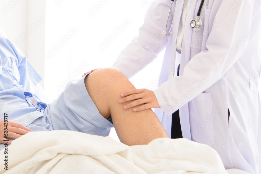 Doctor in professional working uniform taking care his patient and diagnosis symptoms on the bed. Doctor in professional working uniform taking care his patient and diagnosis symptoms on the bed.