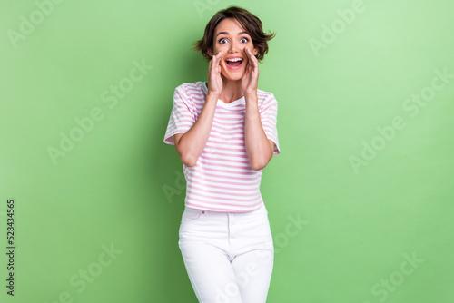 Fototapeta Photo of positive pretty lady striped trendy outfit arm near face tell say harry