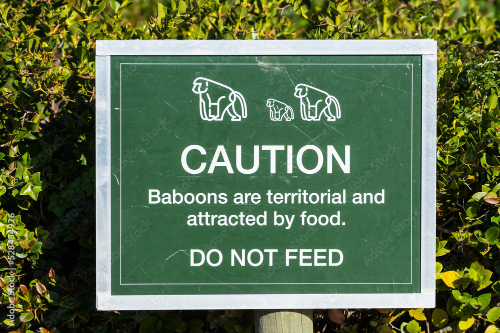 caution do not feed wild animals or baboons sign or signage in South Africa