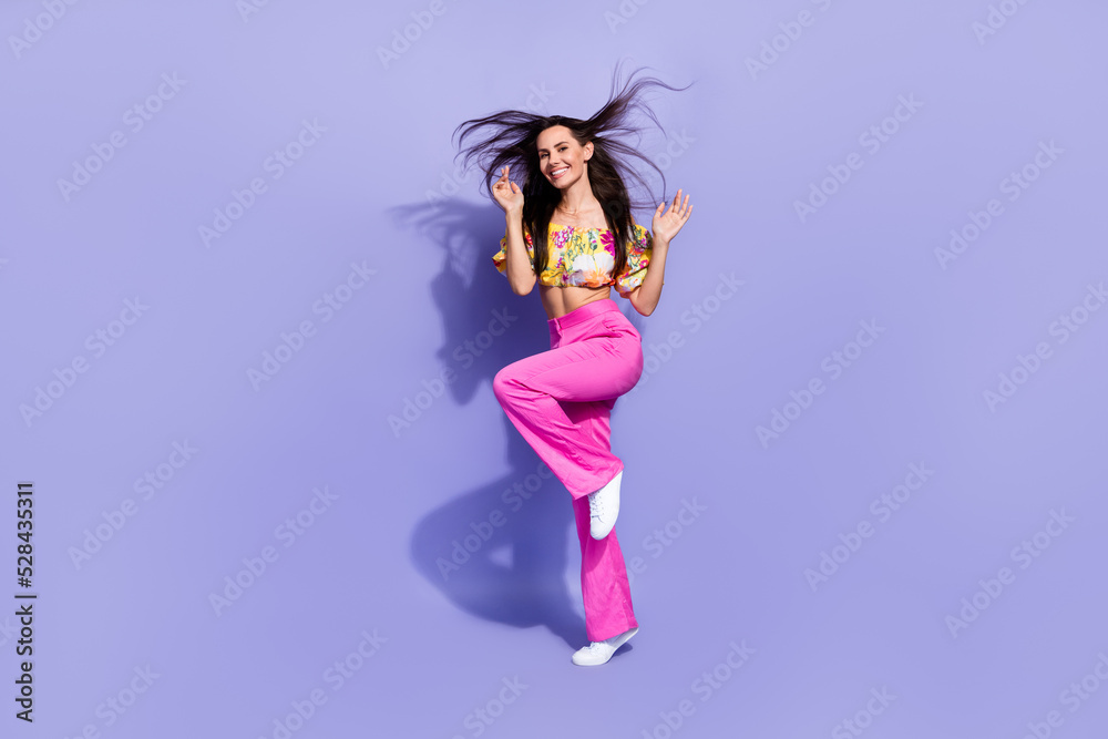 Full body photo of overjoyed lovely lady toothy smile enjoy dancing isolated on violet color background