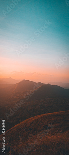 Obraz na plátně sunrise over the mountains,clouds,blues,sky color