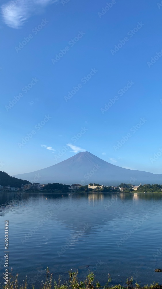 6:22am, the Mt. Fuji clear view of the whole silhouette, the morning bliss moment in August 27th, 2022 from Kawaguchiko lakeshore, Yamanashi prefecture