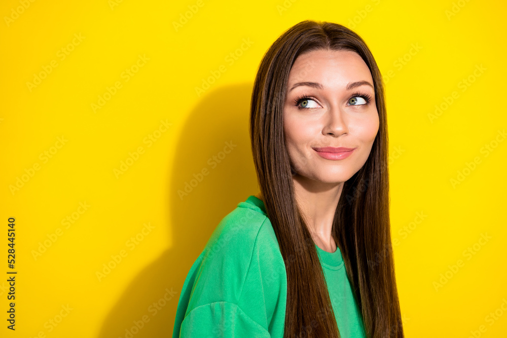 Photo of minded pretty girl look interested empty space isolated on yellow color background Photo of minded pretty girl look interested empty space isolated on yellow color background