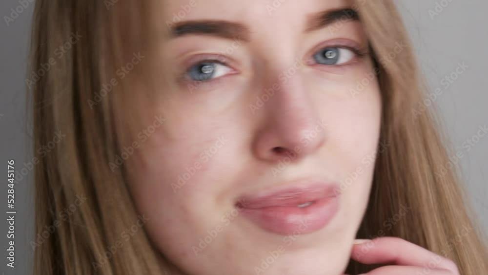 Young girl with blue eyes without makeup posing for the camera Young girl with blue eyes without makeup posing for the camera