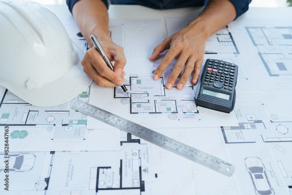 Close-up, architects team are brainstorming, designing and drawing the structure of the building. Close-up, architects team are brainstorming, designing and drawing the structure of the building.