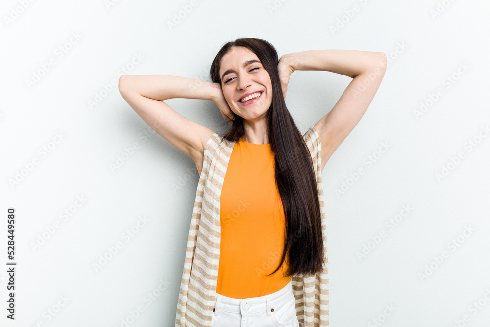 Young caucasian woman isolated on white background stretching arms, relaxed position. Young caucasian woman isolated on white background stretching arms, relaxed position.